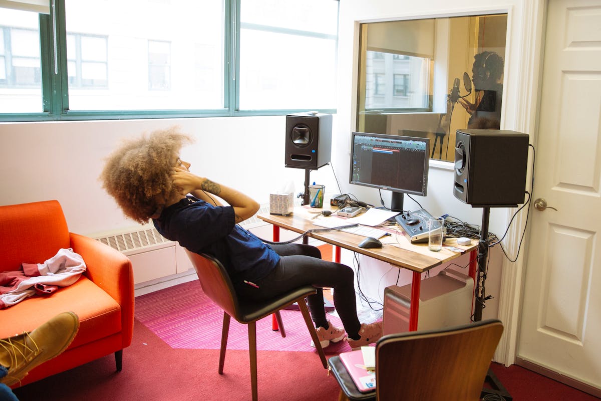 An artist records a track in Flocabulary's in-office recording studio 